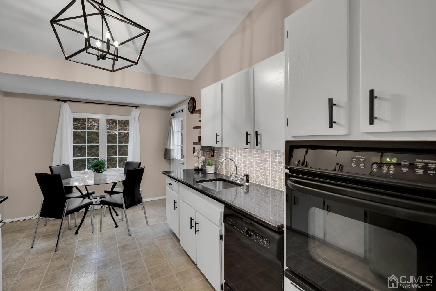 19 Calvin Court Old Bridge, NJ 08857 - Photo 8 of 25 a kitchen with stainless steel appliances a sink stove and cabinets