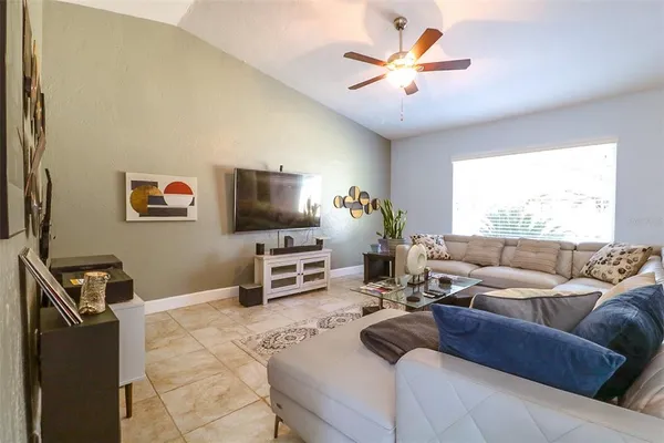 a living room with furniture and a flat screen tv