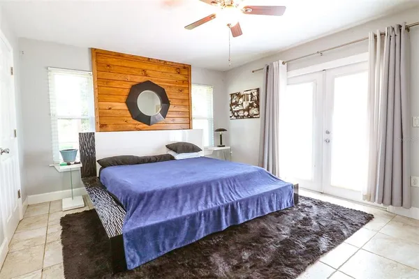 a bedroom with bed and window