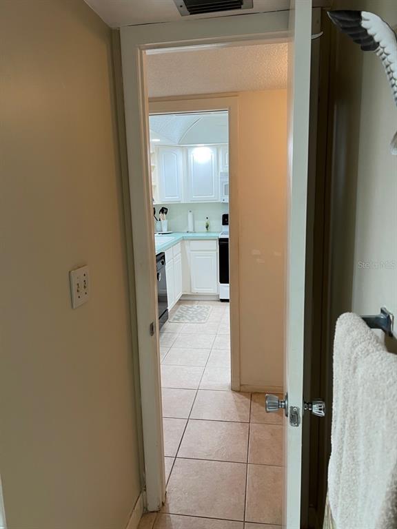 4725 Cove Circle, Unit 108 St. Petersburg, FL 33708 - Photo 12 of 14 a bathroom with a sink and a mirror