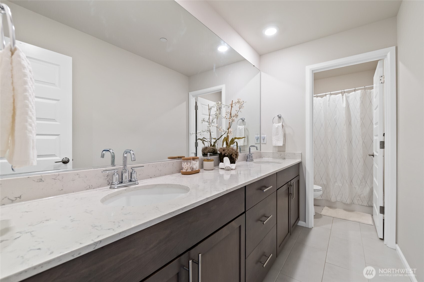 4122 235th Place Southeast Bothell, WA 98021 - Photo 30 of 40 a bathroom with a double vanity sink a and mirror