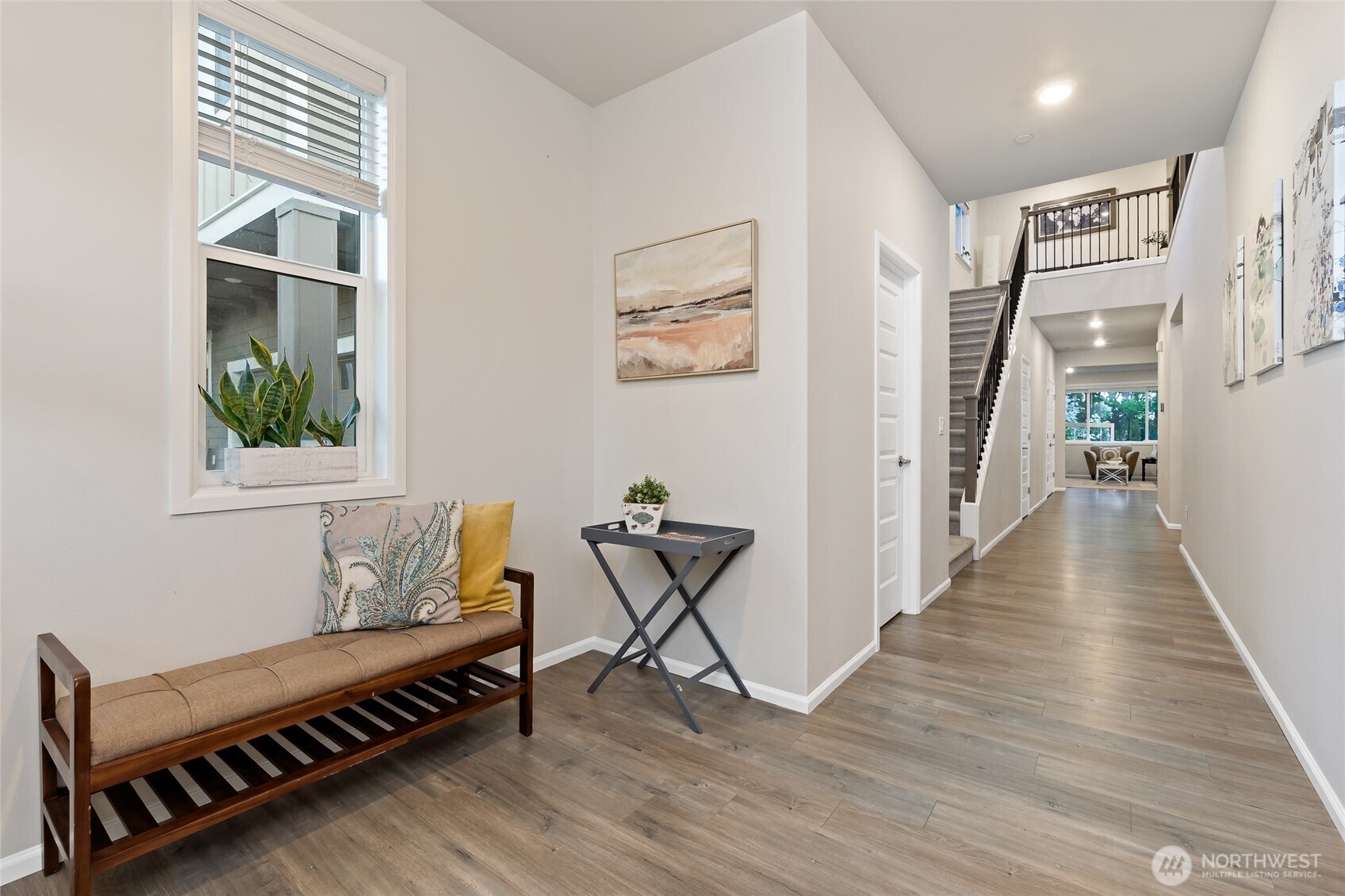 4122 235th Place Southeast Bothell, WA 98021 - Photo 3 of 40 a view of a hallway with wooden floor and windows