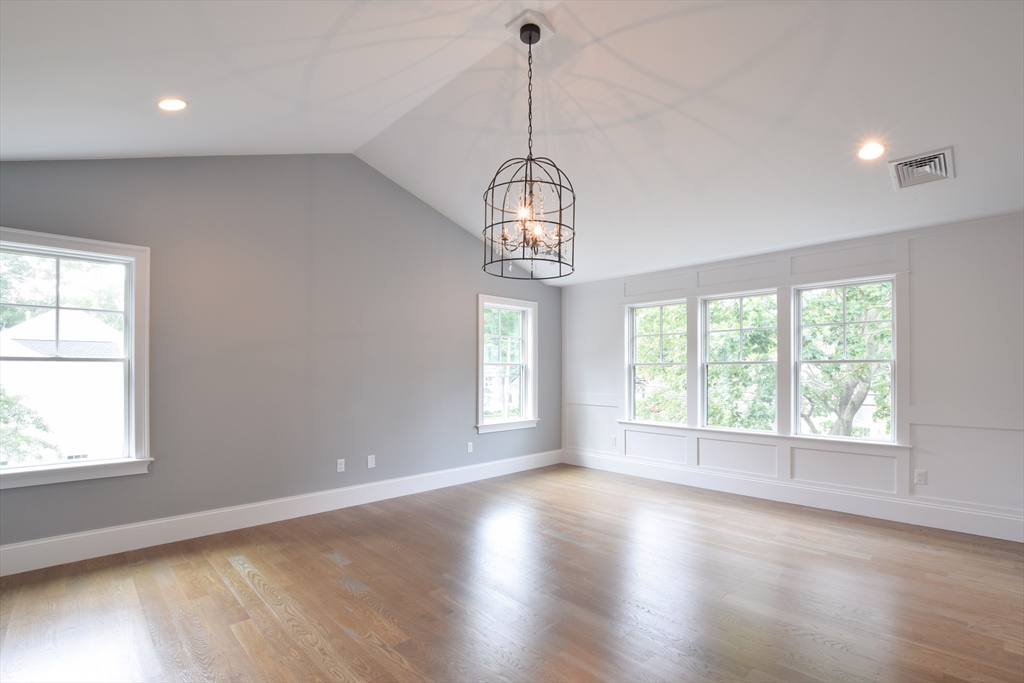 0 Diesel Drive Lincoln, RI 02865 - Photo 3 of 10 an empty room with wooden floor and windows
