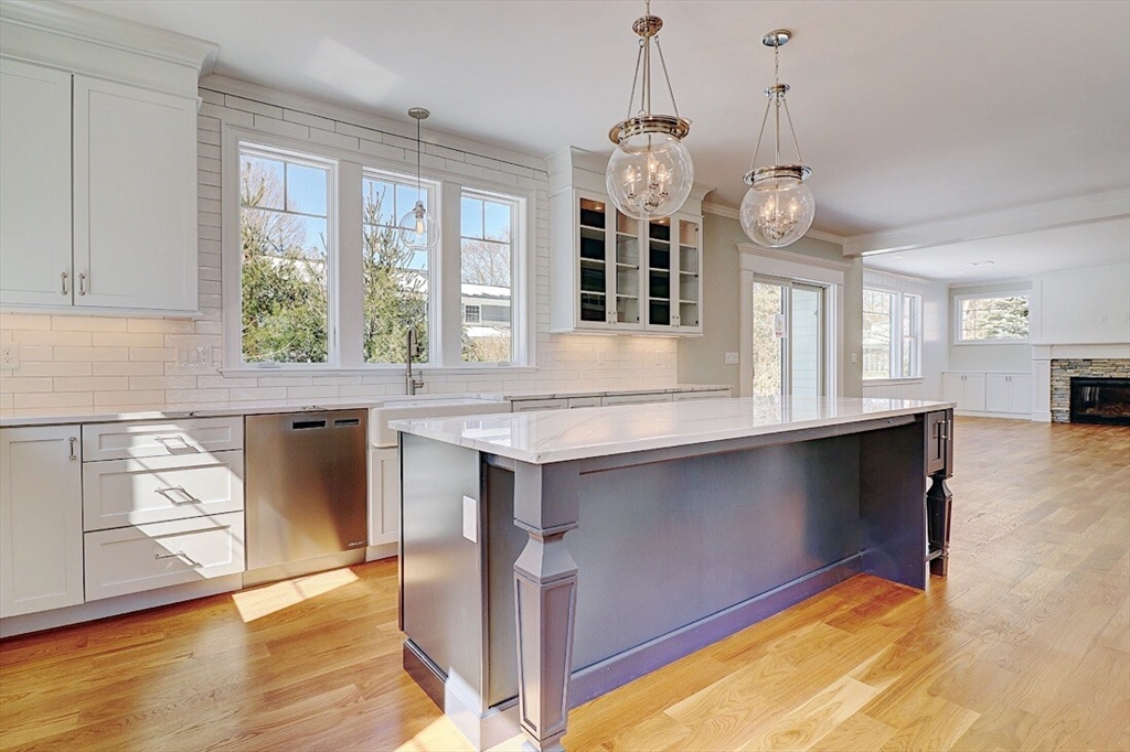 0 Diesel Drive Lincoln, RI 02865 - Photo 5 of 10 a open kitchen with granite countertop a stove a sink and a window