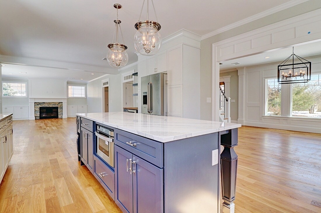 0 Diesel Drive Lincoln, RI 02865 - Photo 6 of 10 a spacious kitchen with stainless steel appliances granite countertop a stove and a wooden floors