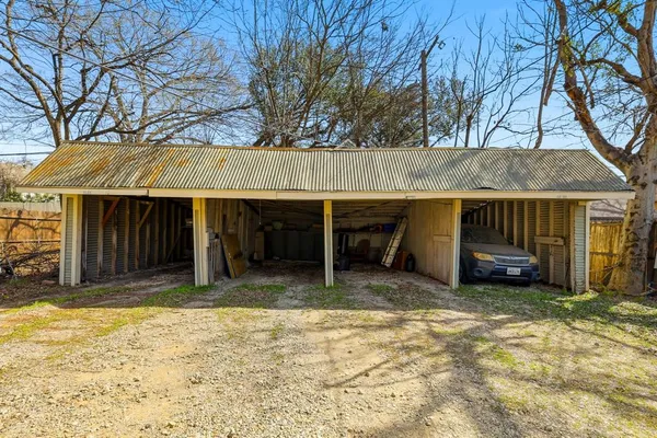 a view of a house with a yard and garage