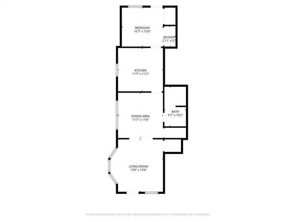 a picture of a bench in front of a white house