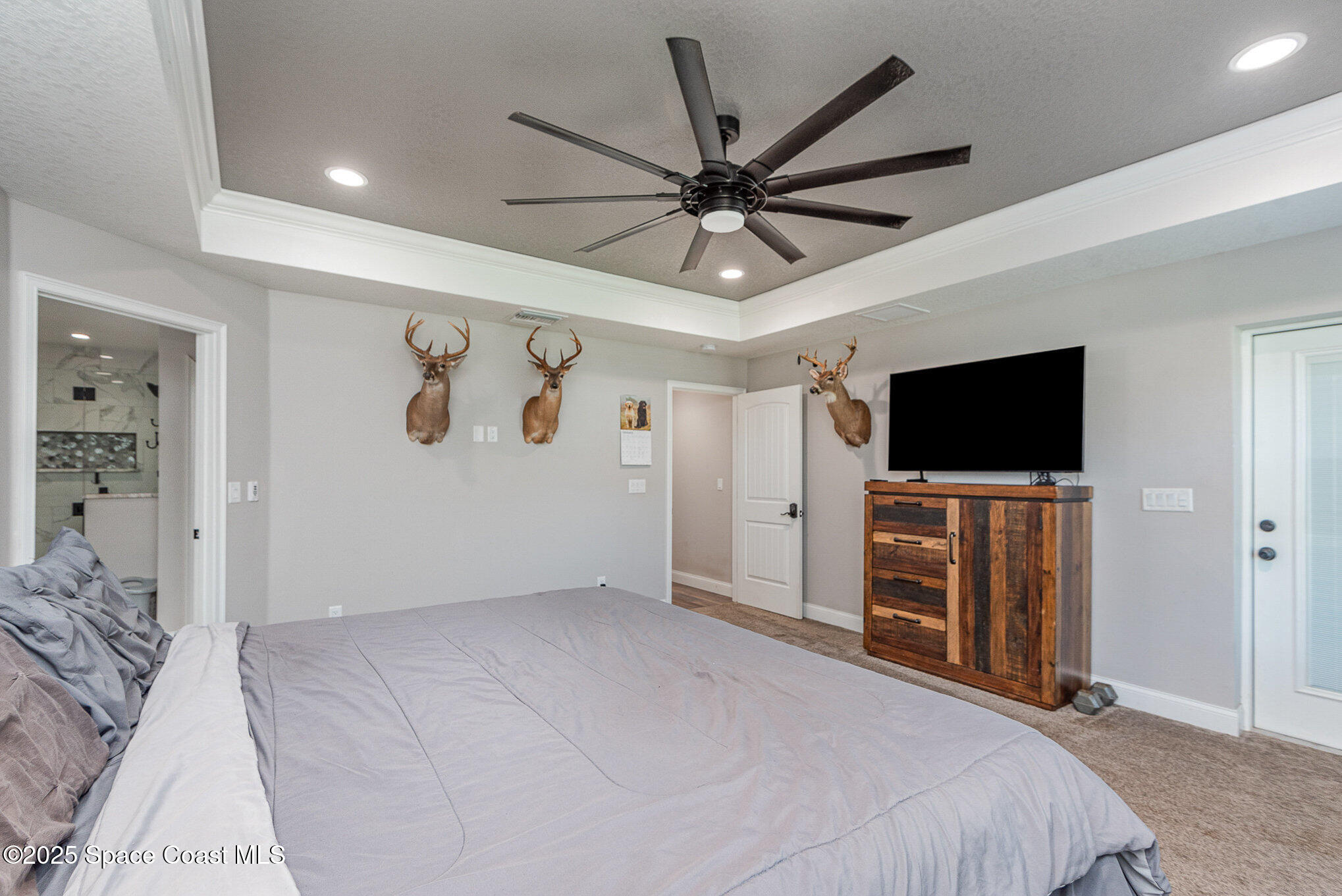 3620 Maebert Road Mims, FL 32754 - Photo 14 of 35 a bedroom with a bed and a flat screen tv