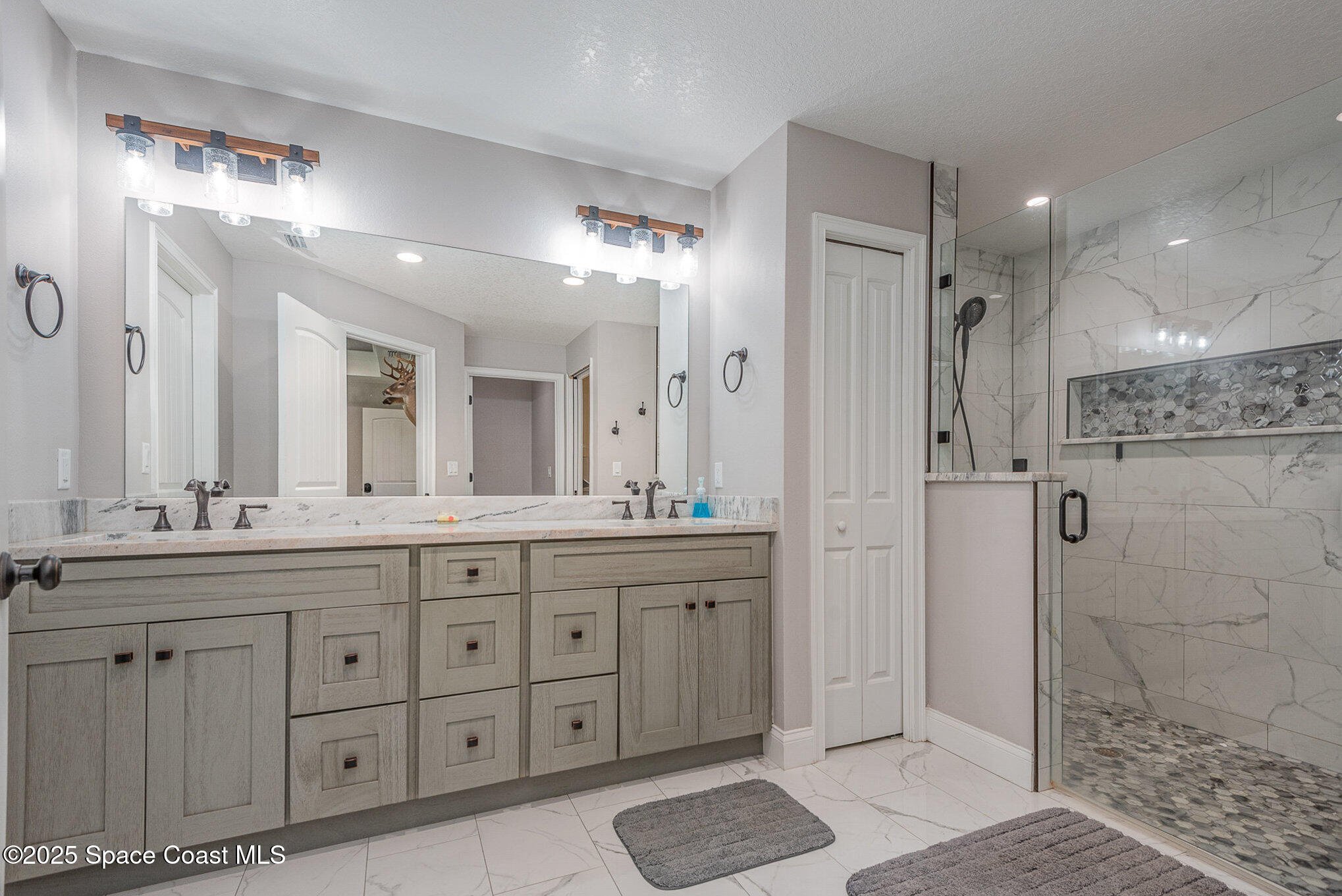 3620 Maebert Road Mims, FL 32754 - Photo 15 of 35 a bathroom with a granite countertop sink mirror and shower