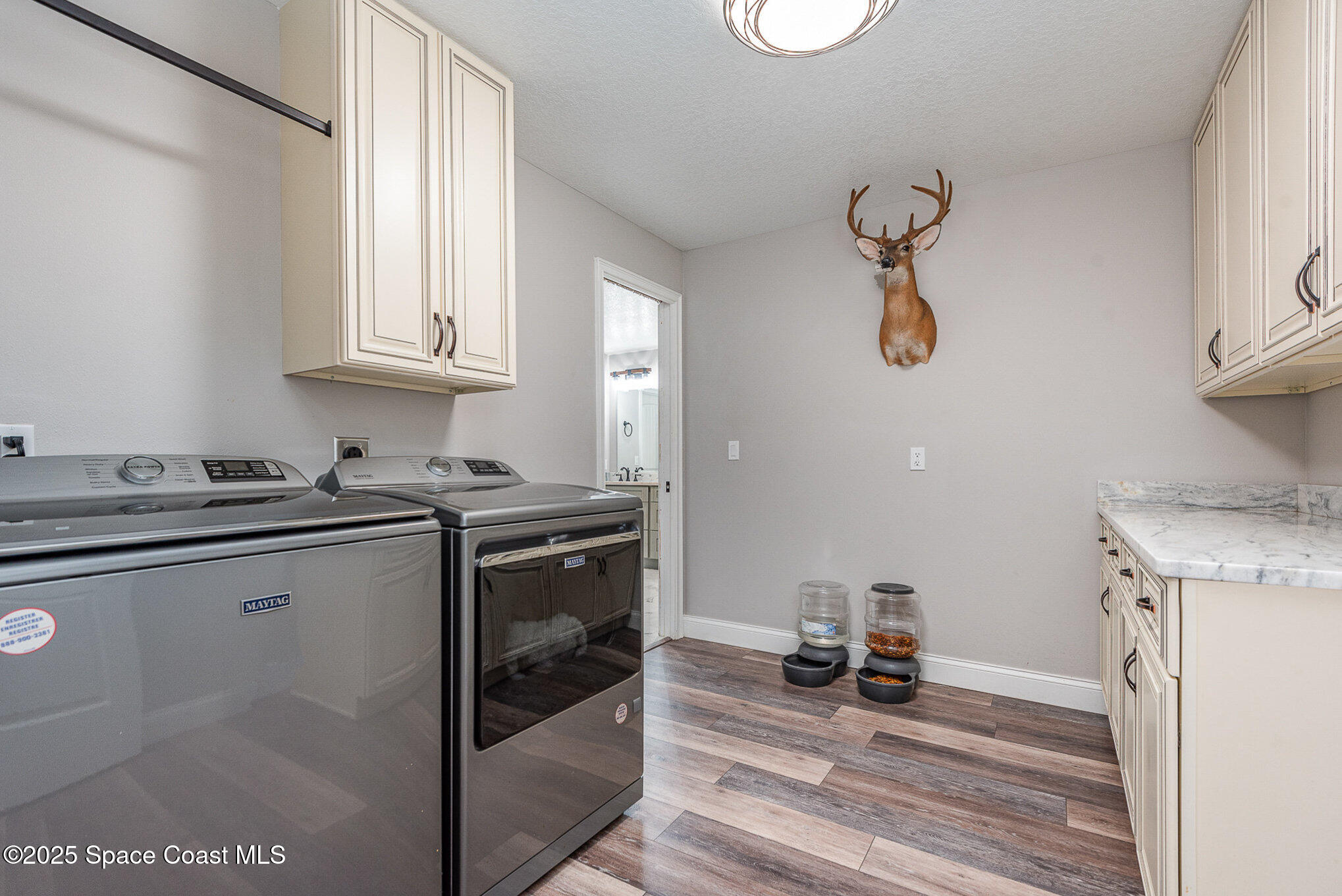 3620 Maebert Road Mims, FL 32754 - Photo 16 of 35 a kitchen with a sink and a stove top oven