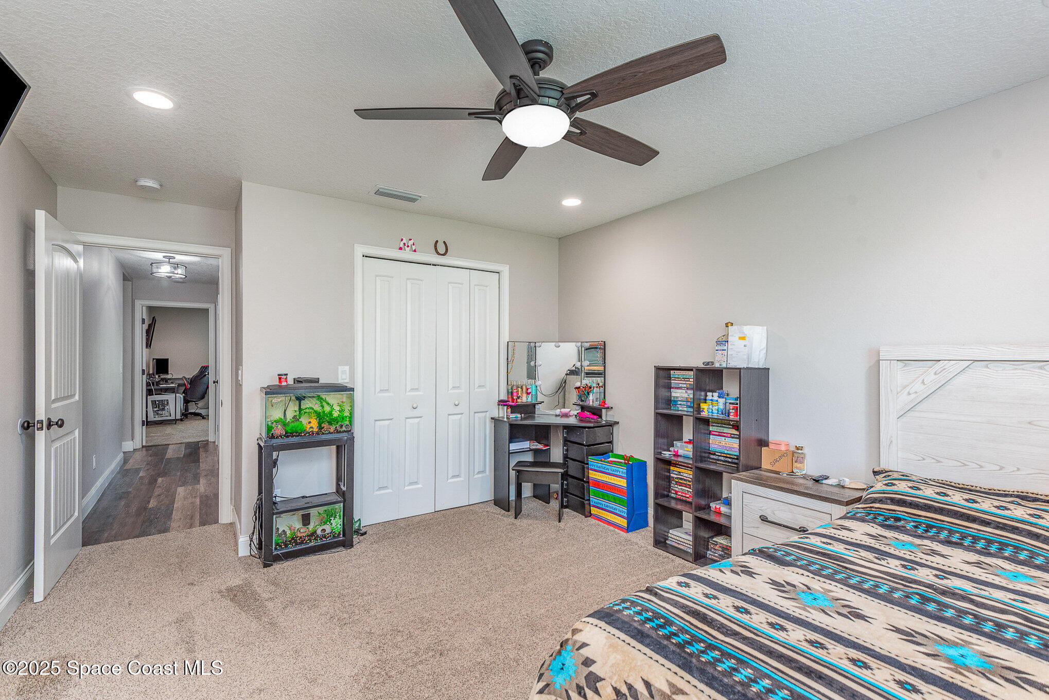 3620 Maebert Road Mims, FL 32754 - Photo 18 of 35 a room with furniture and a book shelf