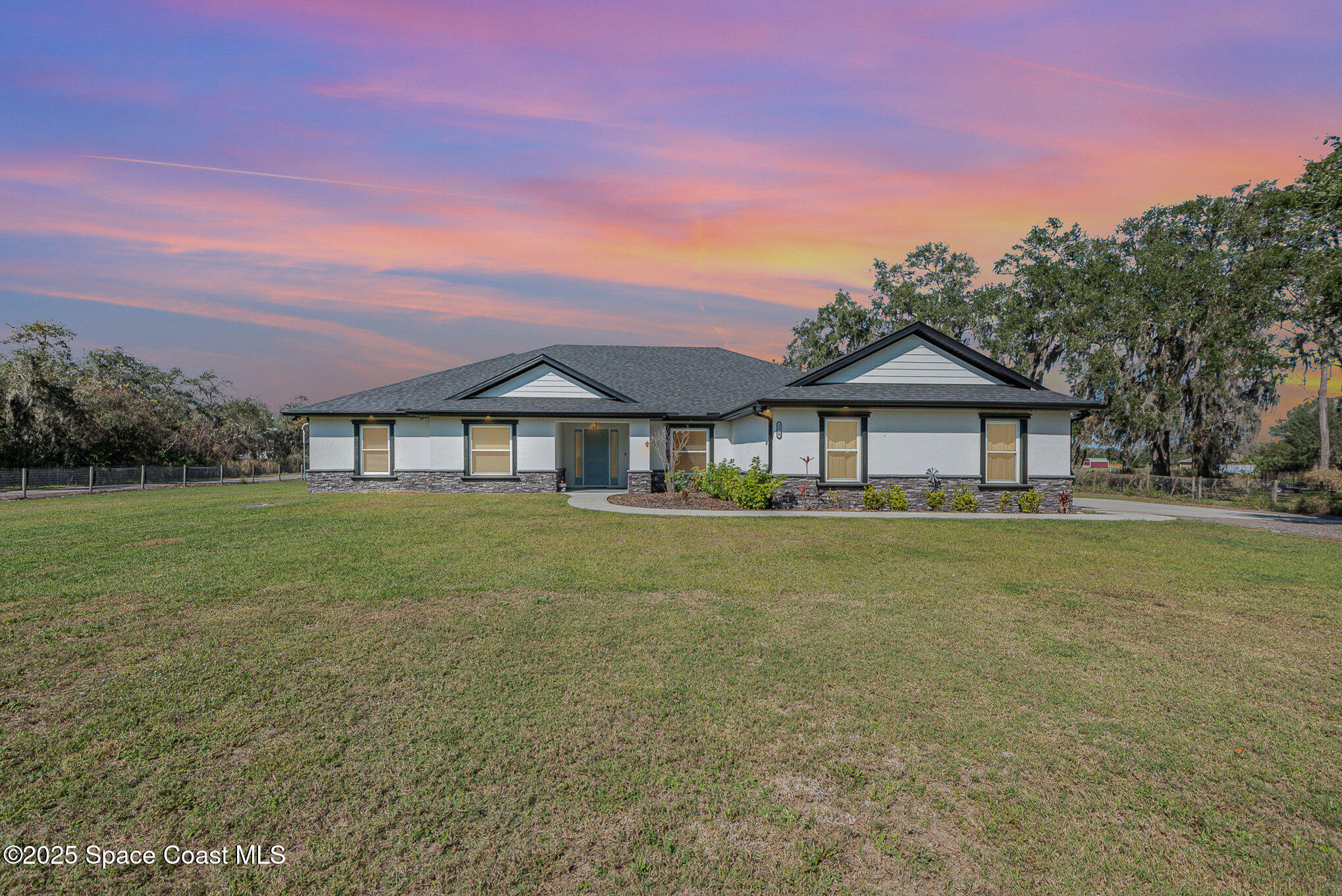 3620 Maebert Road Mims, FL 32754 - Photo 2 of 35 a front view of a house with a yard