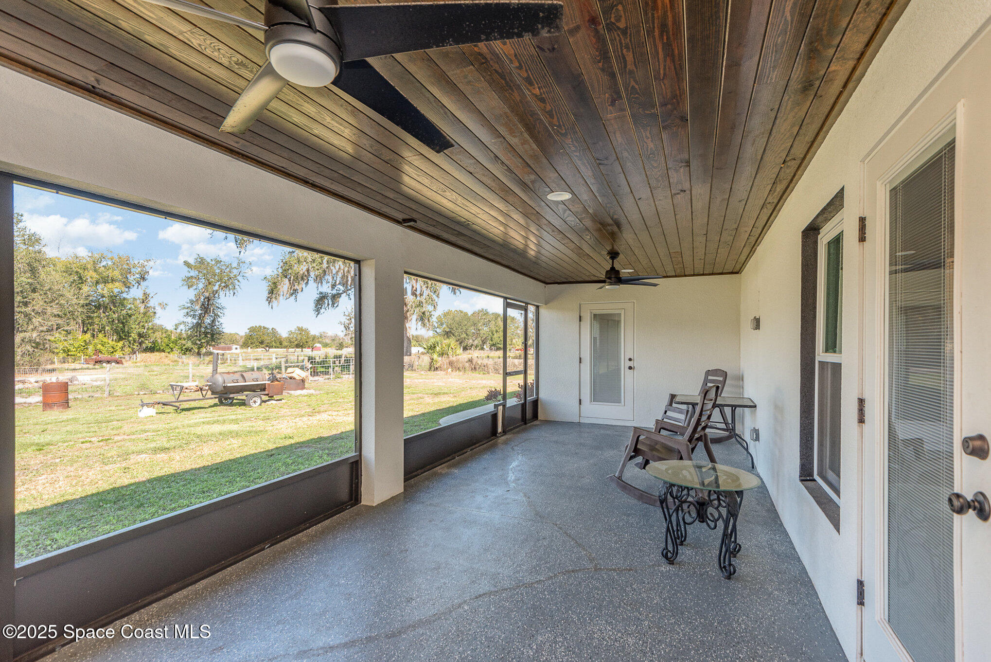 3620 Maebert Road Mims, FL 32754 - Photo 24 of 35 a room with furniture and a large window