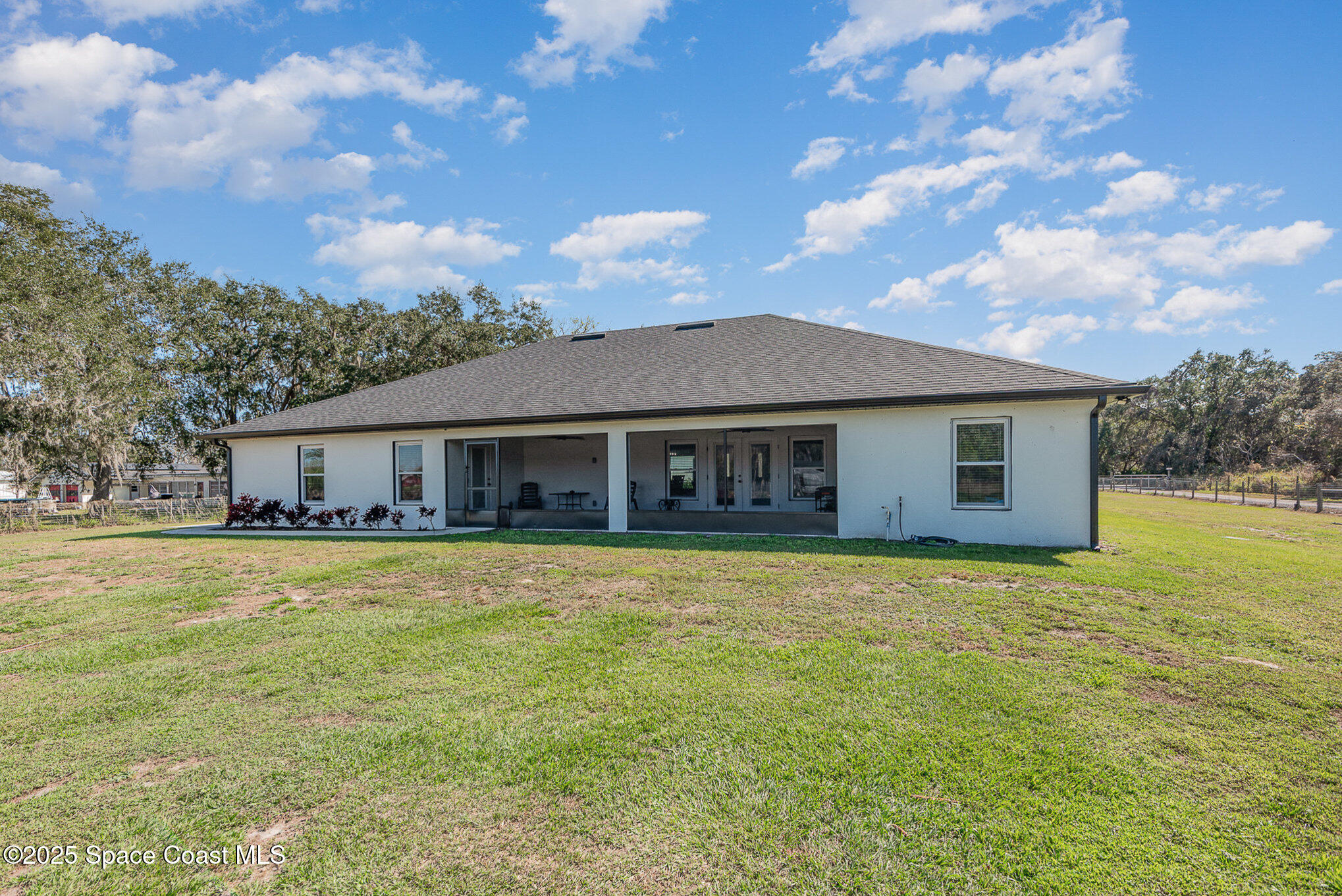 3620 Maebert Road Mims, FL 32754 - Photo 25 of 35 a front view of house with yard and green space