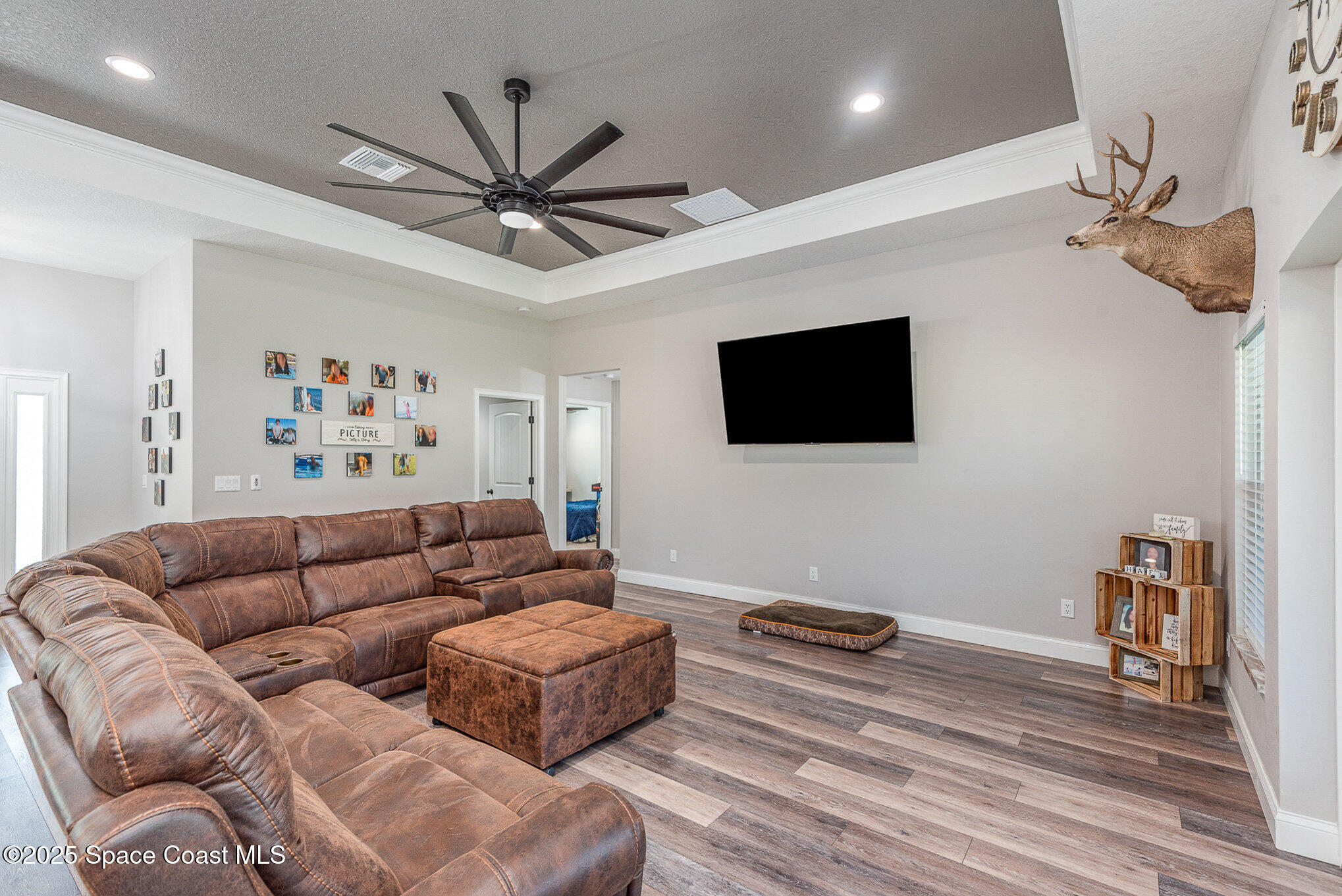 3620 Maebert Road Mims, FL 32754 - Photo 4 of 35 a living room with furniture and a flat screen tv