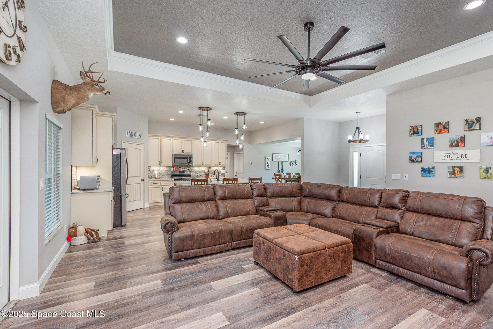 3620 Maebert Road Mims, FL 32754 - Photo 5 of 35 a living room with furniture kitchen view and a chandelier