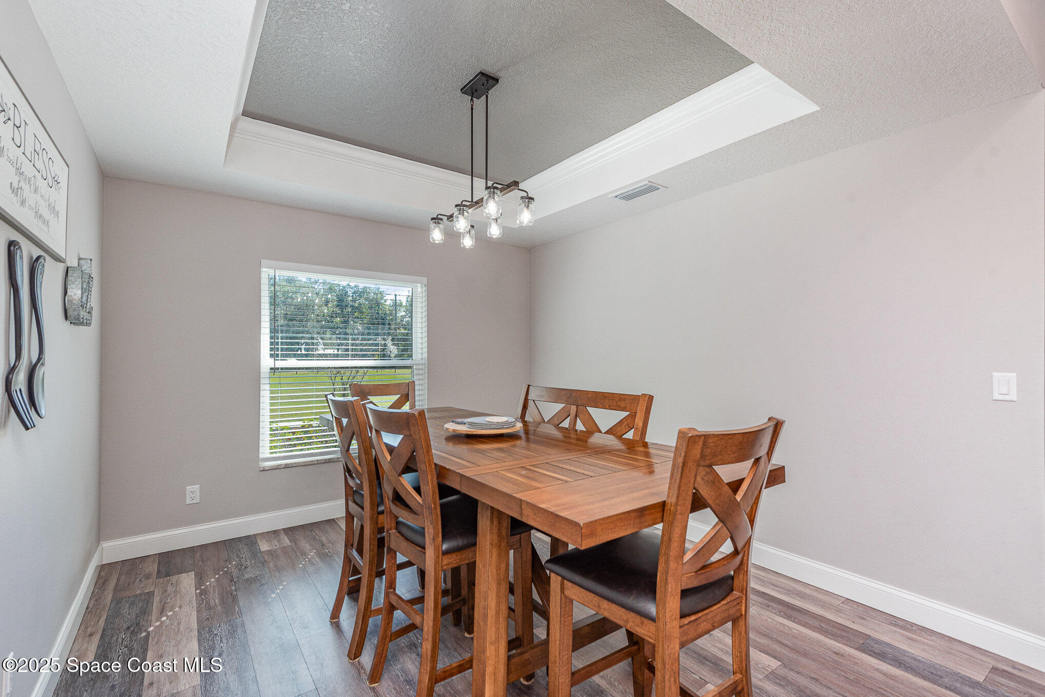 3620 Maebert Road Mims, FL 32754 - Photo 7 of 35 a view of a dining room with furniture window and wooden floor