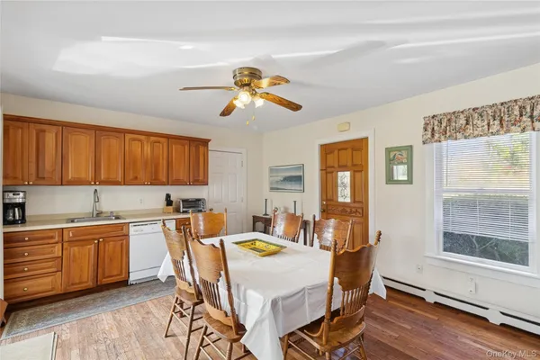 a view of a dining room with furniture window and wooden floor