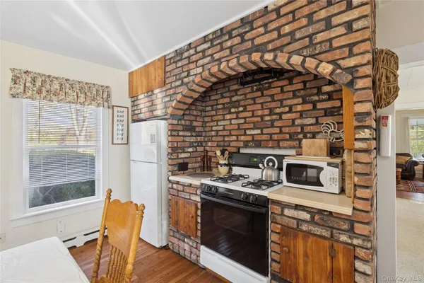 a kitchen with a stove and a cabinet