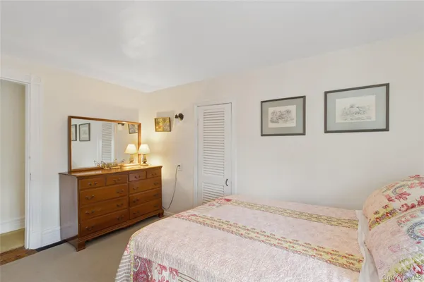 a bedroom with a bed and a cabinets