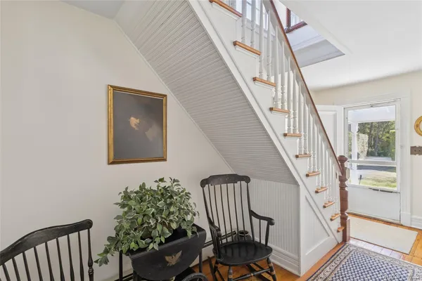 a view of entryway with wooden floor and a potted plant