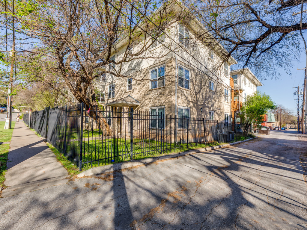 3007 Speedway, Unit 4 Austin, TX 78705 - Photo 1 of 25 a view of a street with a bench and trees
