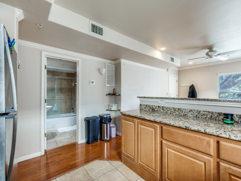 3007 Speedway, Unit 4 Austin, TX 78705 - Photo 15 of 25 a kitchen with stainless steel appliances granite countertop a sink and cabinets
