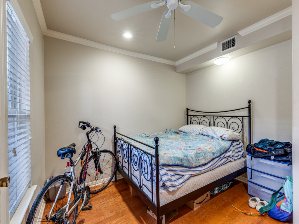 3007 Speedway, Unit 4 Austin, TX 78705 - Photo 19 of 25 a bed sitting in a room next to a window