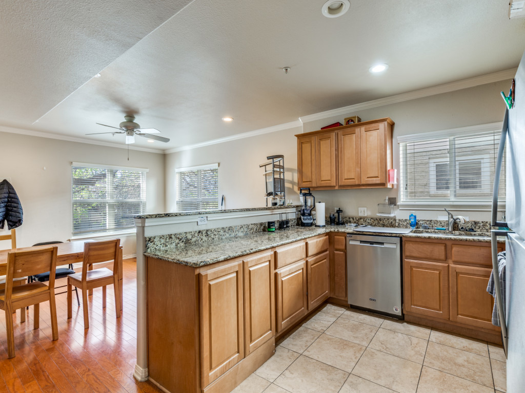 3007 Speedway, Unit 4 Austin, TX 78705 - Photo 7 of 25 a kitchen with a stove sink and cabinets