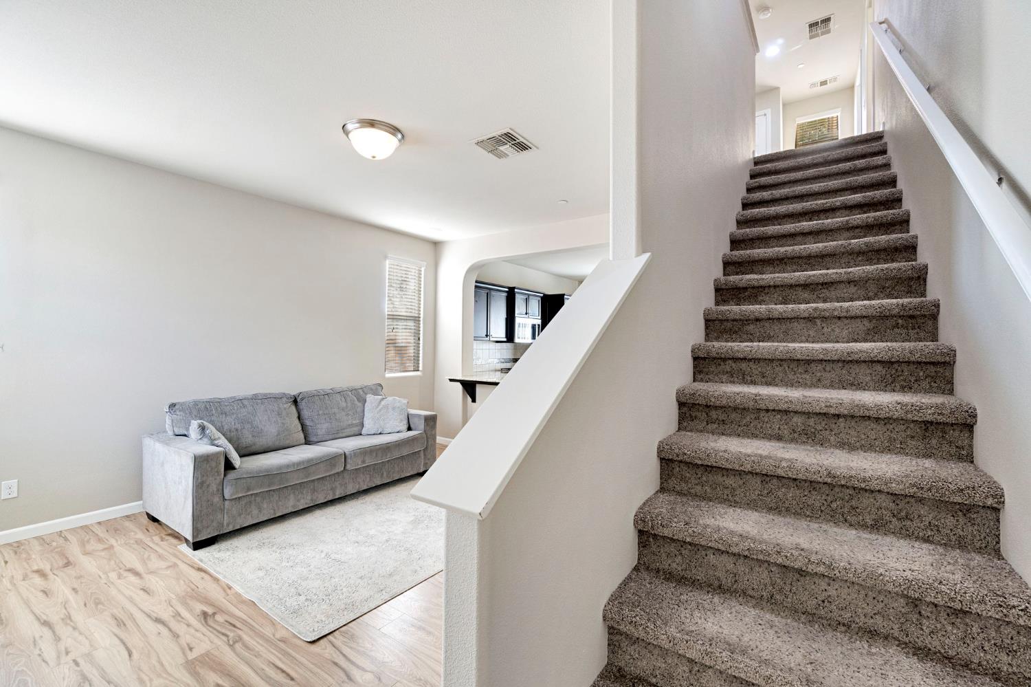 1500 North Encoure Way Clovis, CA 93619 - Photo 14 of 37 a living room with furniture and stairs
