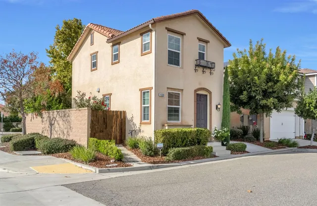 front view of a house with a small yard