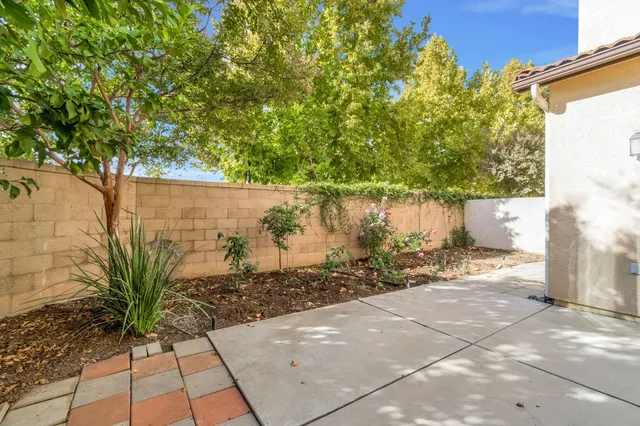 a view of a pathway with a yard