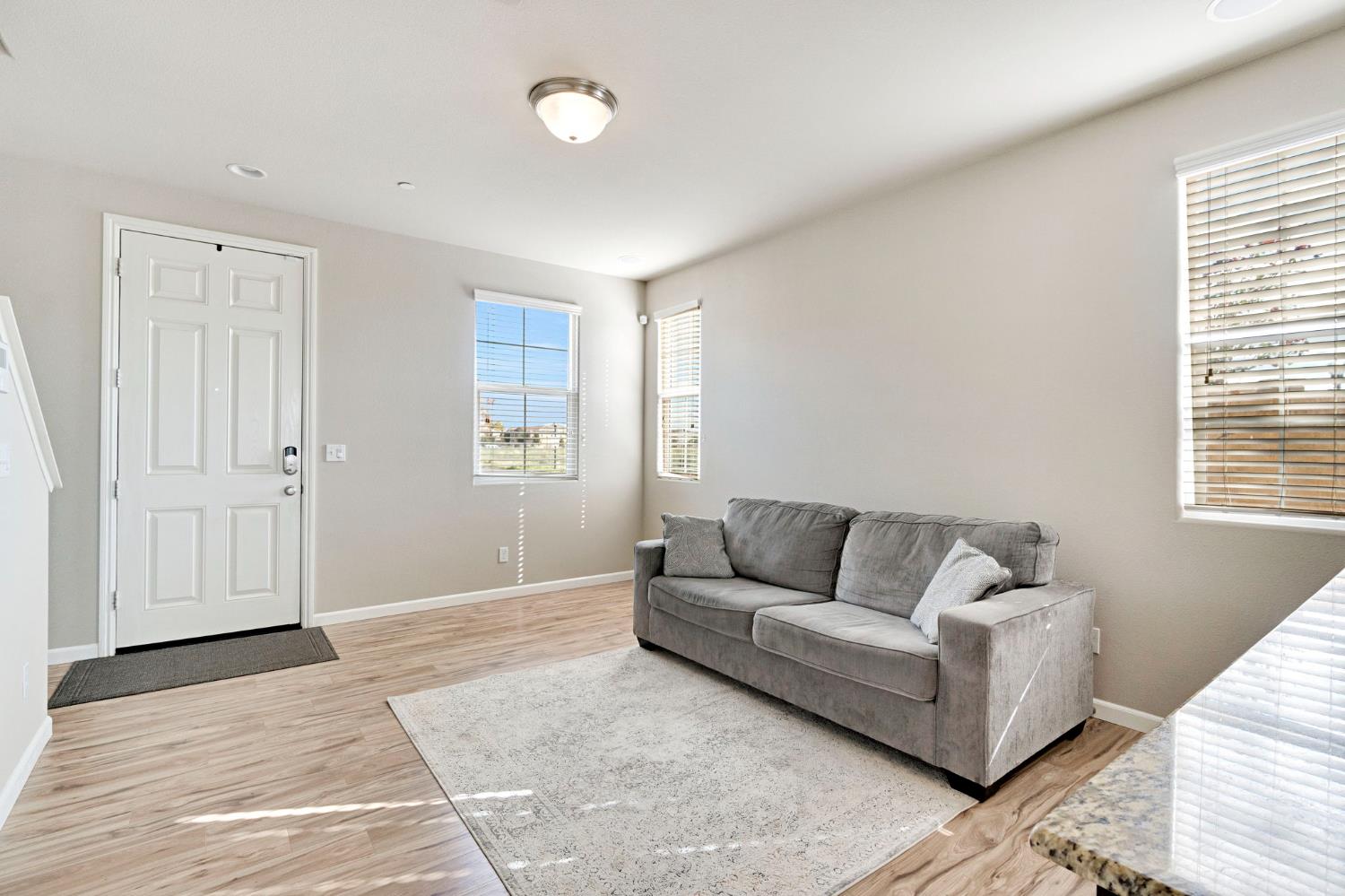 1500 North Encoure Way Clovis, CA 93619 - Photo 6 of 37 a living room with furniture and a window