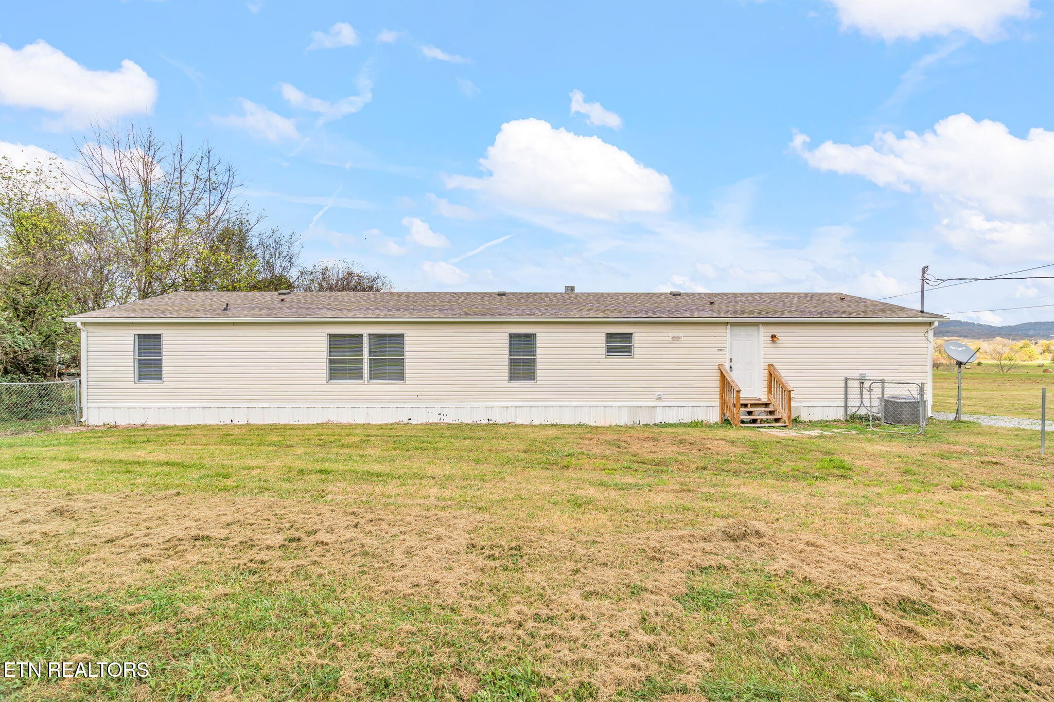 361 Doane Road New Market, TN 37820 - Photo 34 of 39 a view of a big yard next to a large building