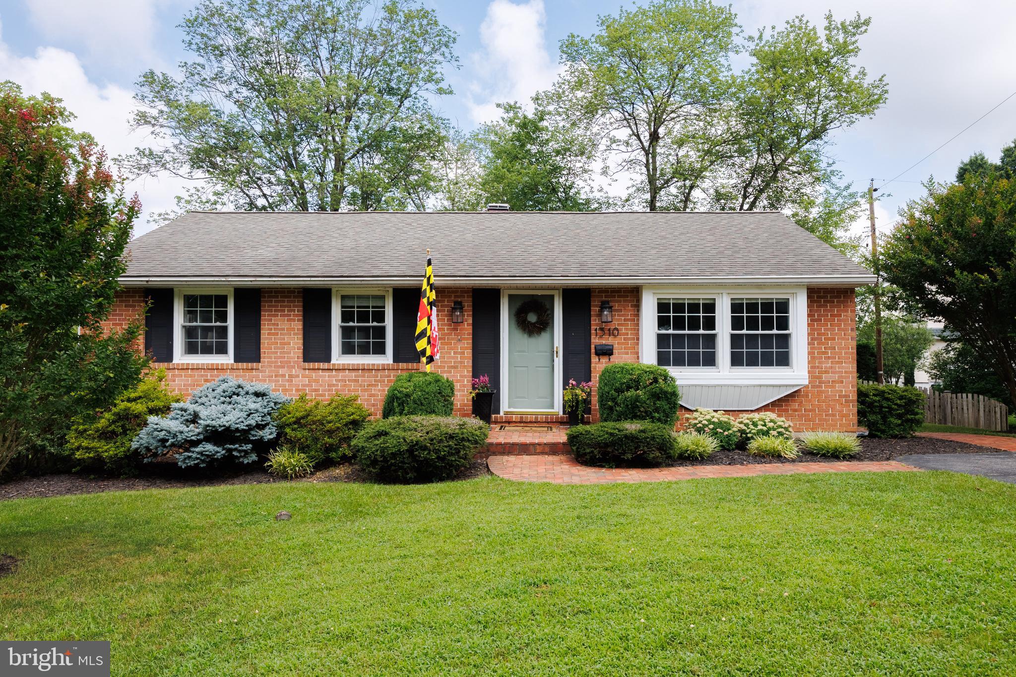 1310 Brook Road Baltimore, MD 21228 - Photo 3 of 67 beautiful front yard, landscaping and a flagpole