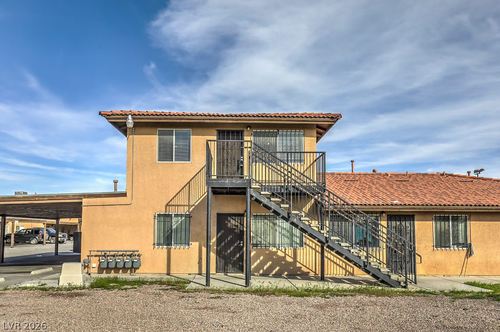 3127 North Walnut Road, Unit A Las Vegas, NV 89115 - Photo 4 of 12 A terracotta-tiled roof crowns this multi-story building, offering functional design and a secure entry.