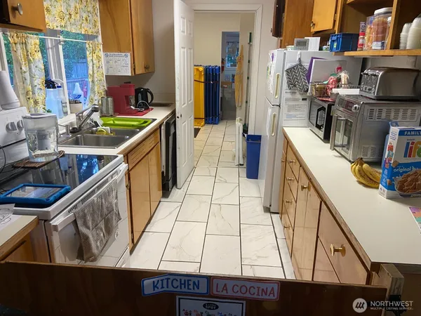 a view of living room with furniture and a window