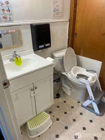 a bathroom with a toilet and a sink