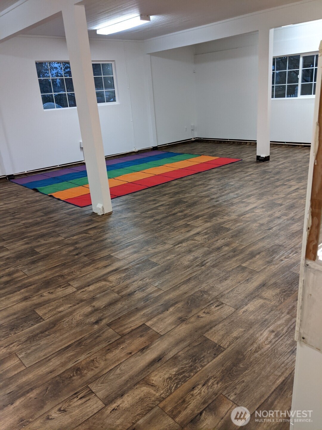 105 Northeast 193rd Street Shoreline, WA 98155 - Photo 9 of 10 a view of empty room with window and wooden floor