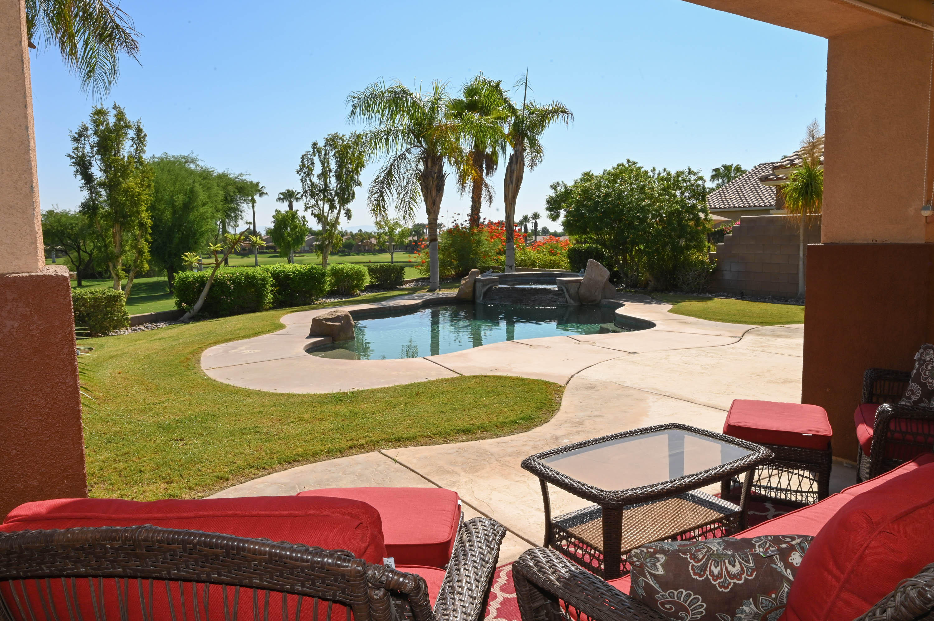 45204 Banff Springs Street Indio, CA 92201 - Photo 13 of 36 a view of a backyard with swimming pool