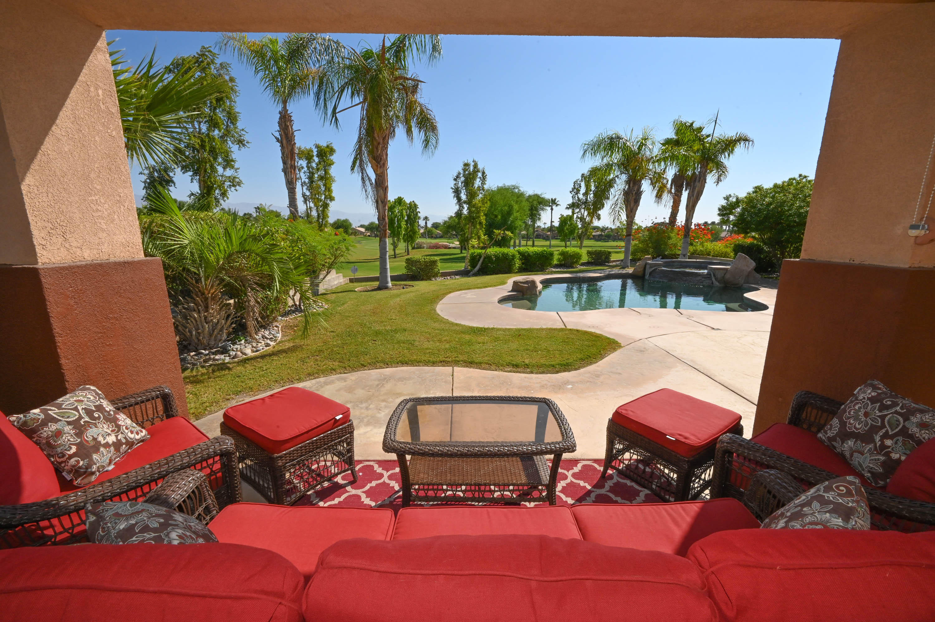 45204 Banff Springs Street Indio, CA 92201 - Photo 14 of 36 a view of a chairs and table in patio