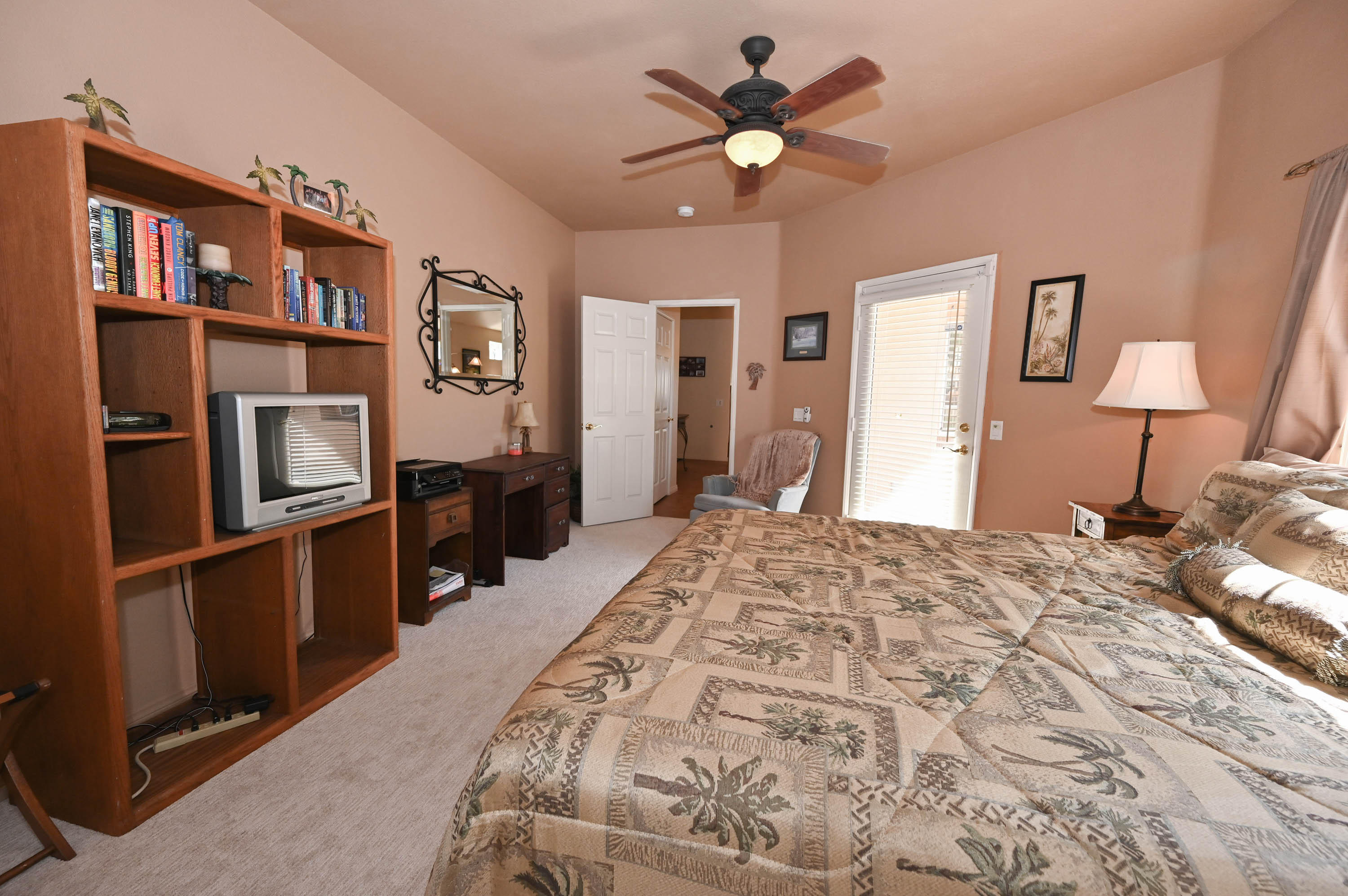 45204 Banff Springs Street Indio, CA 92201 - Photo 29 of 36 a bedroom with a bed dresser and a window