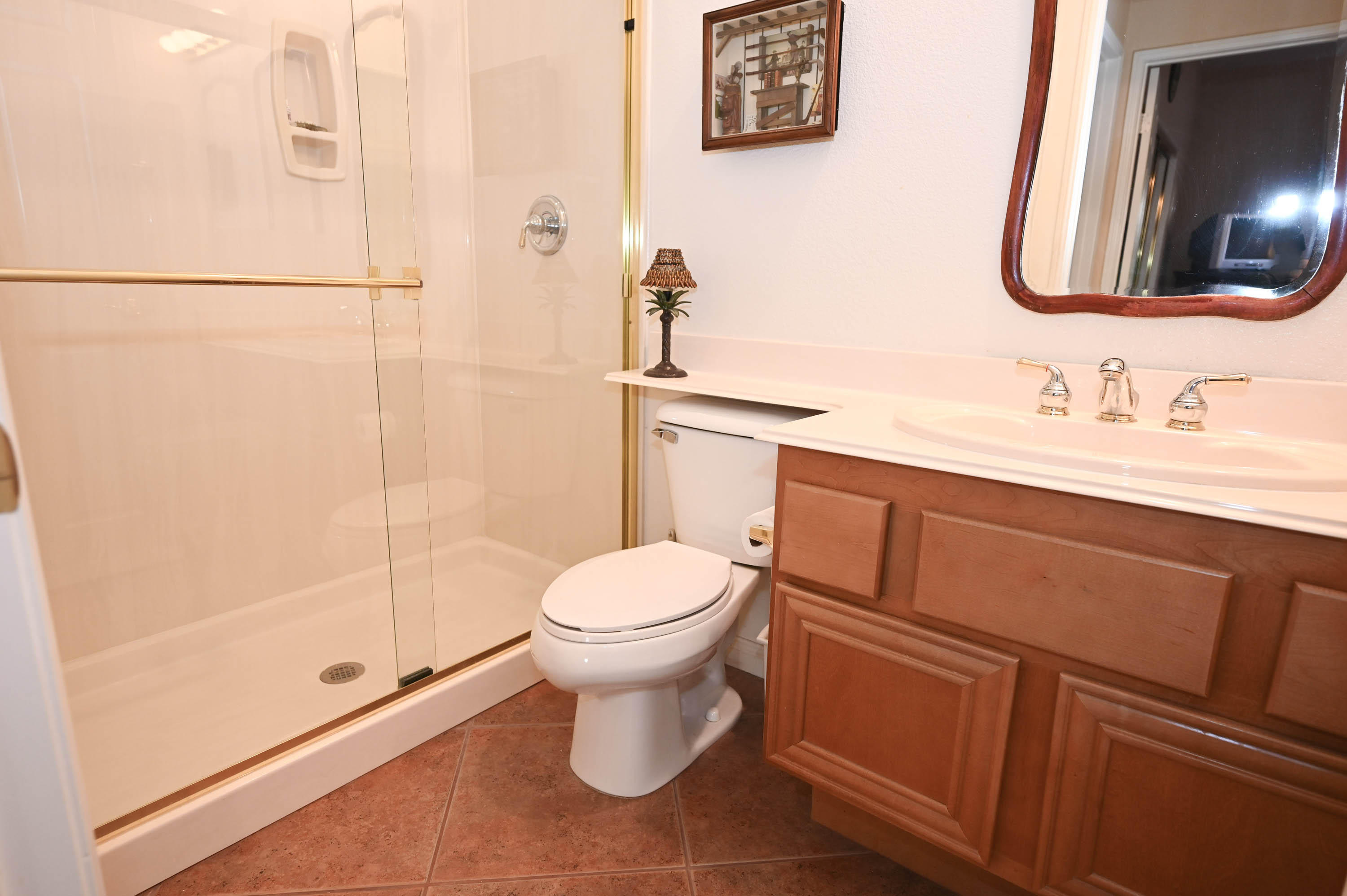 45204 Banff Springs Street Indio, CA 92201 - Photo 31 of 36 a bathroom with a toilet sink and shower