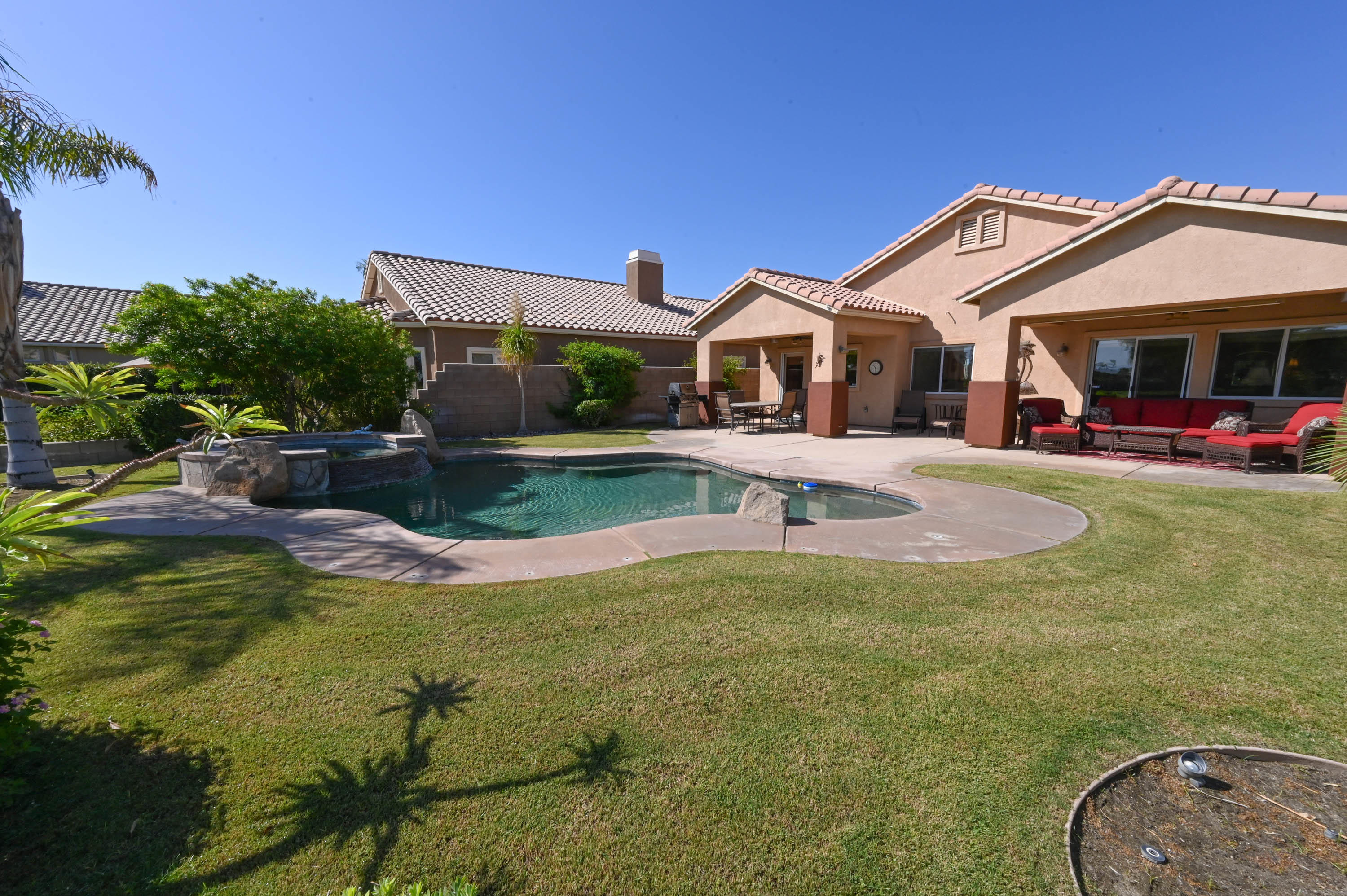 45204 Banff Springs Street Indio, CA 92201 - Photo 6 of 36 a front view of a house with garden