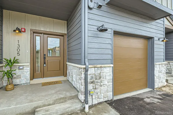 a view of small house with outdoor space