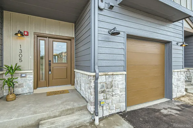 a view of small house with outdoor space
