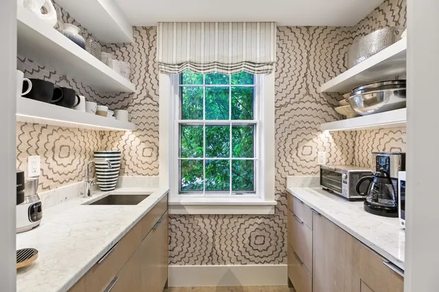 a kitchen with a sink a stove a washer and dryer