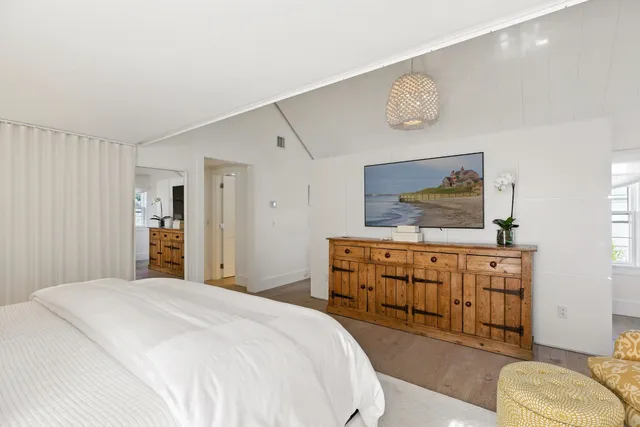 a bedroom with a bed and cabinets