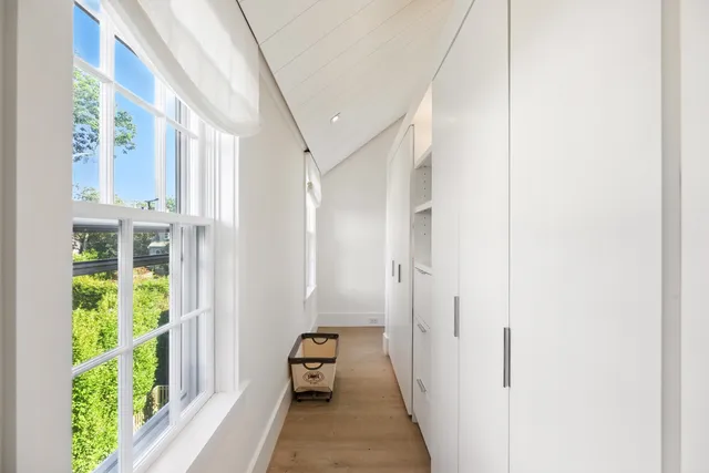 a view of a hallway with windows