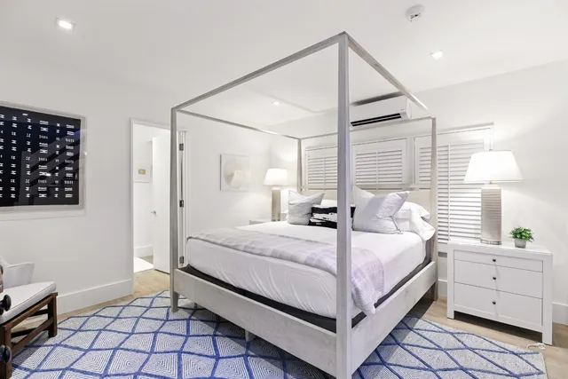 a bathroom with a sink vanity granite shower and a mirror